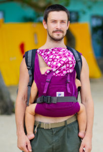 A dad wearing baby safely