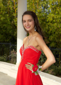 Beautiful High School Senior Posing in her prom dress.