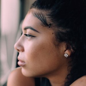 Woman looking out window